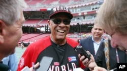 Team World manager Tony Perez talks with the media during batting practice before the All-Star Futures baseball game against Team United States, in Cincinnati, July 12, 2015.