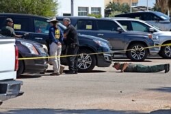 Officials to work the scene Sept. 2, 2019, in Odessa, Texas, where teenager Leilah Hernandez was fatally shot at a car dealership during Saturday's shooting rampage.