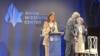 FILE - A survivor of Hamas' Oct. 7, 2023 terror attack, Natalie Sanandaji, left, accepts the Simon Wiesenthal Center's Medal of Valor and another award in New York, Sept. 12, 2024. She participated in a video made to demonstrate solidarity with Iranian women resisting oppression.