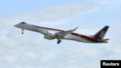 Mitsubishi Aircraft Corp's Mitsubishi Regional Jet (MRJ) takes off for a test flight at Nagoya Airfield in Toyoyama town, Aichi Prefecture, central Japan, in this photo taken by Kyodo November 11, 2015. 