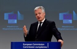 FILE - EU Justice Commissioner Didier Reynders speaks during a press conference at the EU headquarters in Brussels, Belgium, March 17, 2021.