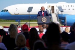 President Donald Trump speaks to a crowd of supporters at Mankato Regional Airport in Mankato, Minn., Aug. 17, 2020.