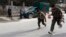 Afghan security forces run after a suicide car bomb attack in Jalalabad province, March 20, 2014.