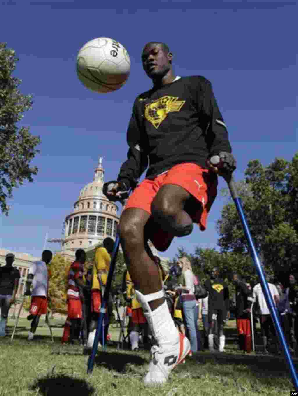 Francois MacKendy, a member of the Haitian National Amputee Soccer Team, plays with the ball an exhibition on the grounds of the Texas state capitol, Tuesday, Nov. 16, 2010 in Austin, Texas. The team is touring throughout the country to raise support for