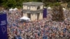 People holding European Union and Moldovan flags fill the Great National Assembly Square in Chisinau, Moldova, May 21, 2023.