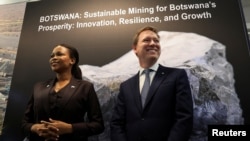 Chief Executive Officer at De Beers Group, Al Cook, and Botswana's Minister of Mineral and Energy, Bogolo Kenewendo, meet for talks on a diamond deal at the Investing in African Mining Indaba in Cape Town, South Africa, Feb. 3, 2025. 