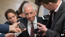 FILE - Senate Foreign Relations Committee Chairman Sen. Bob Corker, R-Tenn. is surrounded by reporters on Capitol Hill in Washington, May 16, 2017. “It's not an automatic for me. It just isn't,” Corker recently told reporters when asked whether he would seek reelection.