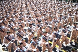 Iranian armed forces members march in a military parade in Tehran, Sept. 22, 2018.