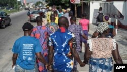 People march in the streets of Lagos as part of the National Day of Mourning, aiming at commemorating all the lives lost to violent killings and mass displacement in the country, on May 28, 2018.