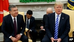 President Donald Trump meets Uzbek President Shavkat Mirziyoyev in the Oval Office of the White House, May 16, 2018, in Washington.