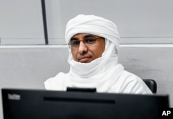 FILE—Al Hassan Ag Abdoul Aziz Ag Mohamed Ag Mahmoud attends his trial at the International Criminal Court in The Hague, Netherlands, May 9, 2022.