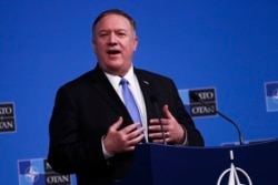 FILE - U.S. Secretary of State Mike Pompeo talks to journalists at the NATO headquarters in Brussels, Nov. 20, 2019.