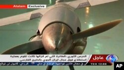 Gambar yang diambil dari televisi Iran berbahasa Arab ini menunjukkan pesawat yang mereka sebut sebagai pesawat tak berawak milik AS, ScanEagle (4/12).