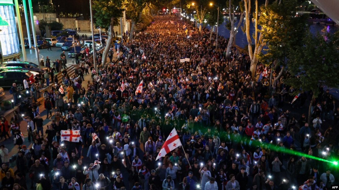 Demonstrators protesting the "foreign influence" law stage a march toward the Georgian Interior Ministry with the demand to release detained fellow protesters, in Tbilisi on May 24, 2024.