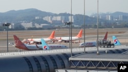 Passenger planes are seen at Gimpo Airport in Seoul, South Korea, on Nov. 9, 2024. North Korean GPS jamming attacks affected dozens of civilian aircraft in South Korea, officials said.