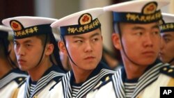 FILE - Members of a military honor guard are seen at People's Liberation Army Navy headquarters outside Beijing, China, July 15, 2014. President Barack Obama is expected to raise China's territorial claims in the South China Sea during a meeting with his Chinese counterpart, President Xi Jinping, on the sidelines of the G-20 summit in Beijing.