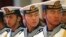 FILE - Members of a military honor guard are seen at People's Liberation Army Navy headquarters outside Beijing, China, July 15, 2014. Despite tensions over China's territorial claims over the South China Sea, Beijing and Washington continue to engage in