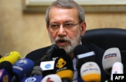 FILE - In this file photo taken Feb. 17, 2020, Iranian Parliament Speaker Ali Larijani gives a press conference at the Iranian Embassy in Beirut.