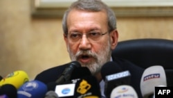 (FILES) In this file photo taken on February 17, 2020, Iranian Parliament Speaker Ali Larijani gives a press conference at the Iranian embassy in the Lebanese capital Beirut. 