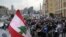 Anti-government protesters block a road that links to Martyrs square, where they set their protest encampment, after it was opened by the security forces in the morning, in downtown Beirut, Jan. 28, 2020.