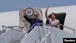 FILE: US Vice President Kamala Harris accompanied by Second Gentleman Doug Emhoff, depart Accra