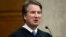 In this Aug. 7, 2018, photo. President Donald Trump's Supreme Court nominee, Judge Brett Kavanaugh, officiates at the swearing-in of Judge Britt Grant to take a seat on the U.S. Court of Appeals for the Eleventh Circuit in Atlanta at the U.S. District Courthouse in Washington.