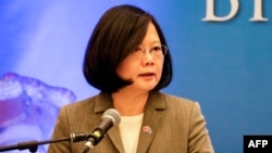 FILE - Taiwan's President Tsai Ing-wen delivers a speech during a meeting with businessmen from Nicaragua and Taiwan in Managua, Jan. 10, 2017.