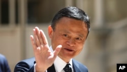 FILE - Founder of Alibaba group Jack Ma arrives for the Tech for Good summit in Paris, France, May 15, 2019. Ma recently stepped down as chairman of the e-commerce giant.
