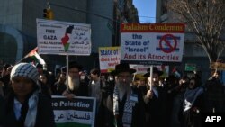 Pro Palestine protesters demonstrate outside UN headquarters prior to a vote at the General Assembly in New York City on Dec. 12, 2023.