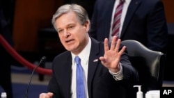 FBI Director Christopher Wray testifies before the Senate Judiciary Committee on Capitol Hill in Washington, March 2, 2021. Wray is condemning the Jan. 6 riot at the Capitol as “domestic terrorism.”