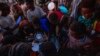 Men who fled the conflict in Ethiopia's Tigray region receive rice from charity organization Muslim Aid at a camp in Qadarif, Sudan, Nov. 27, 2020. Ethiopian Prime Minister Abiy Ahmed again ruled out dialogue with leaders of the Tigray region Nov. 27.