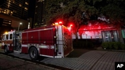 A firetruck is positioned outside the Chinese Consulate Wednesday, July 22, 2020, in Houston. Authorities responded to reports of a fire at the consulate. Witnesses said that people were burning paper in what appeared to be trash cans.