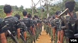 FILE - Arakan Army recruits scale the climbing ropes at the Laiza, Kachin state, base camp. (Steve Sandford/VOA)
