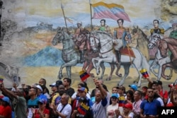 Supporters of Venezuelan President Nicolas Maduro be  a rally called by the ruling enactment      2  months aft  the disputed statesmanlike  predetermination  successful  Caracas, Venezuela, Sept. 28, 2024.