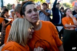 FILE —Sandra Miasnik, right, an aunt of Argentine-Israeli infant Kfir Bibas, a hostage of Hamas in Gaza, attends a gathering one day before his first birthday in Buenos Aires, Argentina, January 17, 2024.