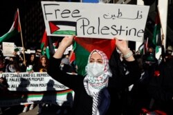 Protesters march through the streets of Chicago's Loop in support of Palestinians, May 12, 2021.