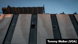 Windows on the fifth floor of The Ember Hotel were broken by firefighters during a fire at the hotel on Dec. 29, 2024. (Tommy Walker/VOA)