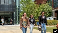 FILE - Students walk across the Gordon State College campus on April 16, 2024, in Barnesville, Ga.