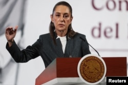 Mexico's President Claudia Sheinbaum holds a press conference a day before the imposition of tariffs by President Donald Trump, at the National Palace in Mexico City, March 3, 2025.