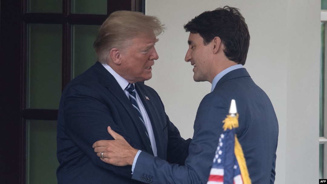 (FILES) US Presidnt Donald Trump greets Canadian Prime Minister Justin Trudeau at the White House in Washington, DC, on June 20, 2019.