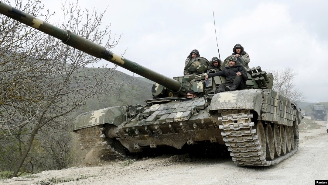 A tank of the self-defense army of Nagorno-Karabakh moves on the road near the village of Mataghis, April 6, 2016. 