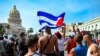 Cubans are seen outside Havana's Capitol during a demonstration against the government of Cuban President Miguel Diaz-Canel in Havana, July 11, 2021. 
