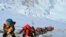 FILE - A long queue of mountain climbers line a path on Mount Everest just below camp four, in Nepal, May 22, 2019.