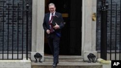 FILE - Britain's Prime Minister Keir Starmer leaves 10 Downing Street to attend the weekly Prime Minister's Questions session in Parliament, in London, Feb. 12, 2025.