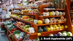 In this April 24, 2014 file photo, a variety of healthy fruits and vegetables are displayed for sale at a market in Washington. (AP Photo/J. Scott Applewhite, File)