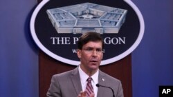 FILE - US Defense Secretary Mark Esper speaks during a Pentagon briefing in Washington.