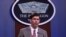 FILE - Defense Secretary Mark Esper speaks during a briefing at the Pentagon in Washington.