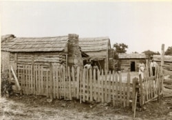 FILE - A Freedmen cabin is pictured in Okmulgee, Indian Territory, c. 1898-1901. (Courtesy - Oklahoma Historical Society)