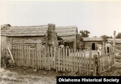 FILE - A Freedmen cabin is pictured in Okmulgee, Indian Territory, c. 1898-1901. (Courtesy - Oklahoma Historical Society)