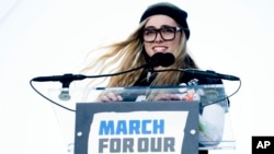 FILE - Delaney Tarr, a survivor of the mass shooting at Marjory Stoneman Douglas High School in Parkland, Florida, speaks during the "March for Our Lives" rally in support of gun control in Washington, March 24, 2018.